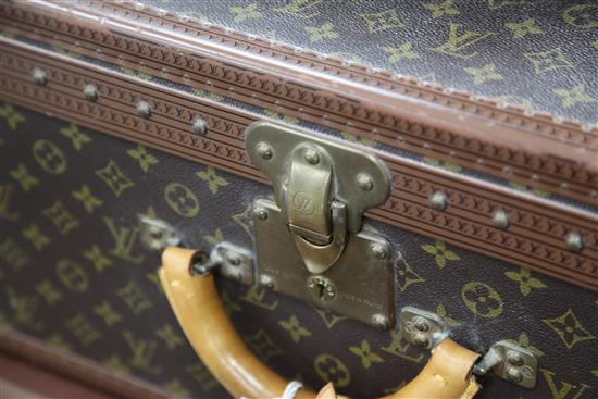 A large Louis Vuitton suitcase, 21in.